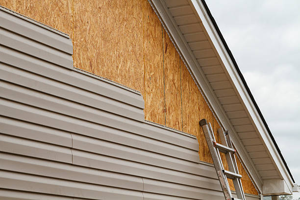 Professional Storm Damage Siding Repair technician working in Wade, NC